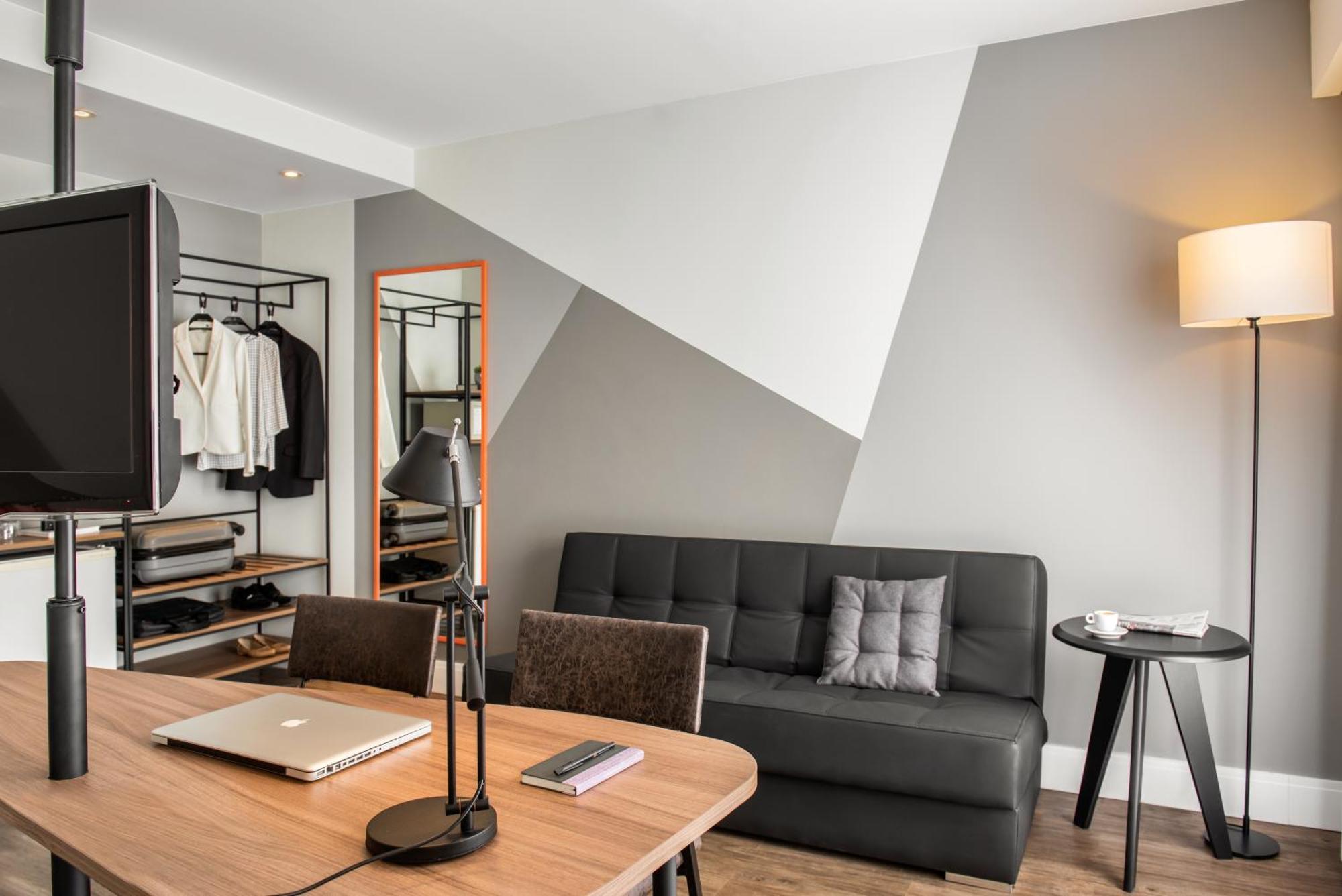 Quarto superior de luxo com 2 camas de solteiro e 1 sofá-cama